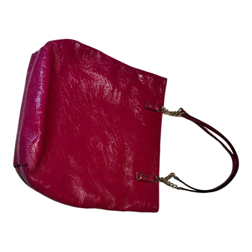 Michael Kors patent leather handbag in a sleek, glossy finish.